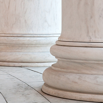 Close-up view of the bases of two large marble columns